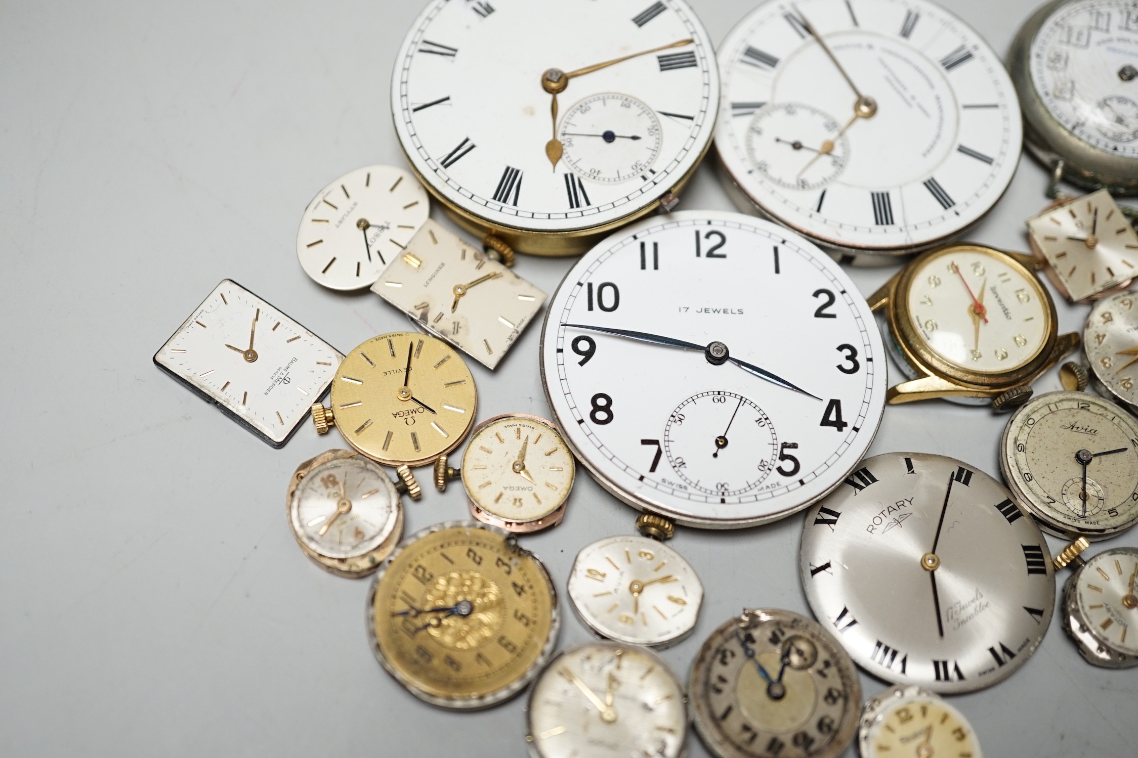 A collection of assorted wrist and pocket watch parts.